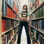 Female Student Holding a Pile of Books