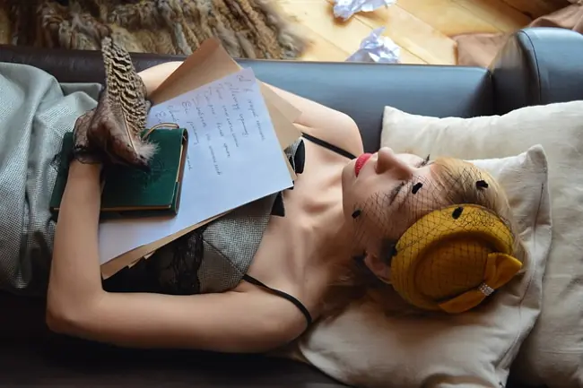 Student thinking about how to write an essay about herself