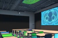 Students collaborate in a modern classroom using holographic projectors and AI tablets, with warm cinematic lighting highlighting polished wood surfaces and detailed textures.