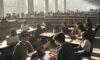 A diverse group of college students collaborating over laptops and tablets in a sunlit, modern university library surrounded by textbooks.