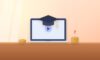 Laptop with an online lecture under a graduation cap, with coin stacks and a question mark
