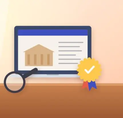 Laptop showing a university website, an accreditation seal with a check mark and a magnifying glass