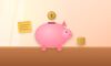 Piggy bank with a coin dropping in, a stack of coins and a sticky note with side-job ideas