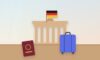 Classic German city gate with the German flag, a passport and a suitcase