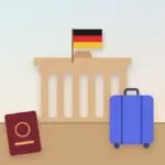 Classic German city gate with the German flag, a passport and a suitcase