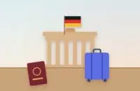 Classic German city gate with the German flag, a passport and a suitcase